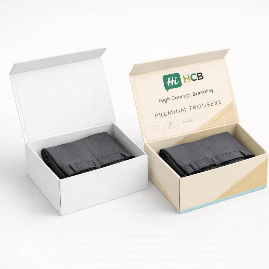 A side-by-side comparison of a plain white and a branded cream hinged lid trousers box- class=